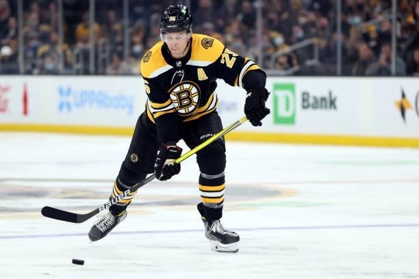 Brandon Carlo of the Boston Bruins takes a shot on goal against the Philadelphia Flyers during the third period of the preseason game at TD Garden on...