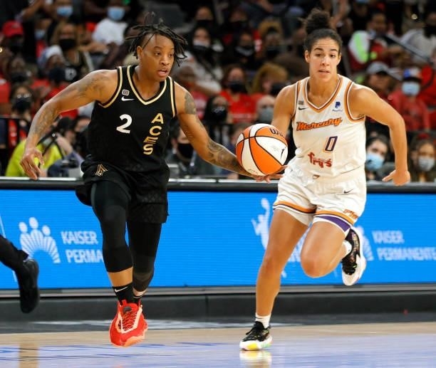 Riquna Williams of the Las Vegas Aces brings the ball up the court after stealing it from Kia Nurse of the Phoenix Mercury during Game Two of the...