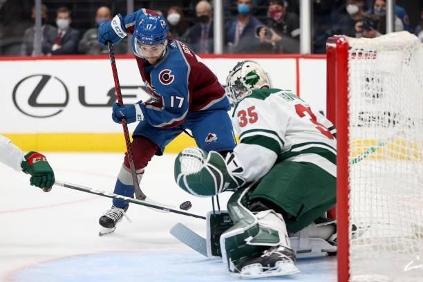 Tyson Jost of the Colorado Avalanche tries to score against goalie Andrew Hammond of the Minnesota Wild in the second period at Ball Arena on...