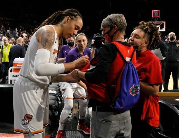 Brittney Griner of the Phoenix Mercury signs autographs for fans after Game Two of the 2021 WNBA Playoffs semifinals against the Las Vegas Aces at...