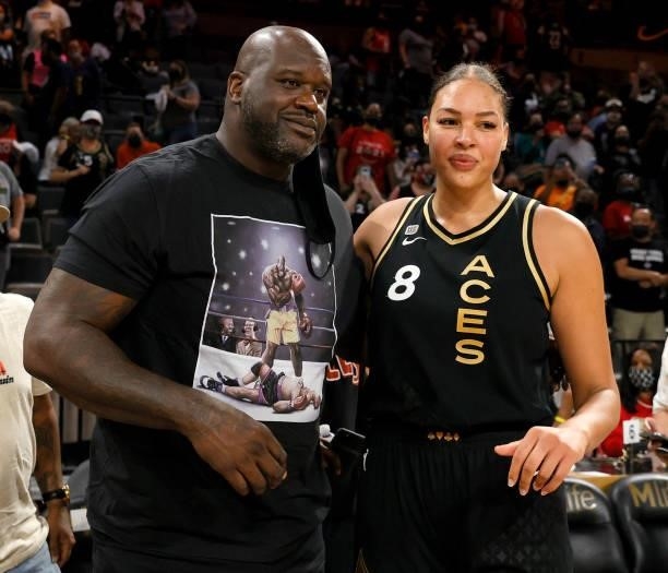 Former NBA player Shaquille O'Neal and Liz Cambage of the Las Vegas Aces pose for photos after Game Two of the 2021 WNBA Playoffs semifinals between...
