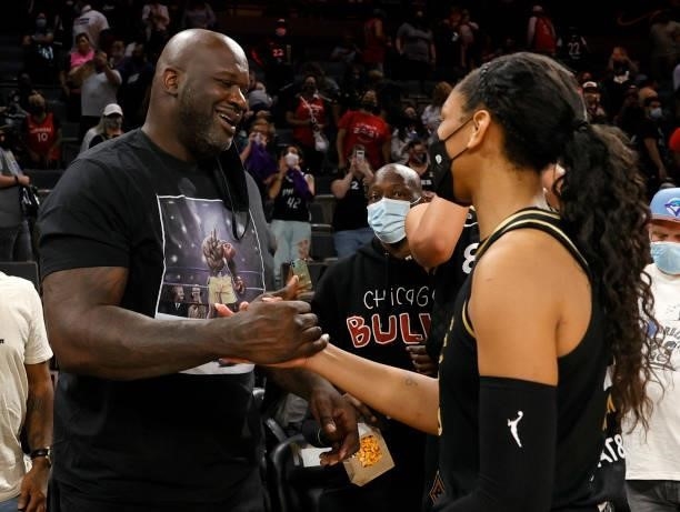 Former NBA player Shaquille O'Neal greets A'ja Wilson of the Las Vegas Aces after Game Two of the 2021 WNBA Playoffs semifinals between the Aces and...