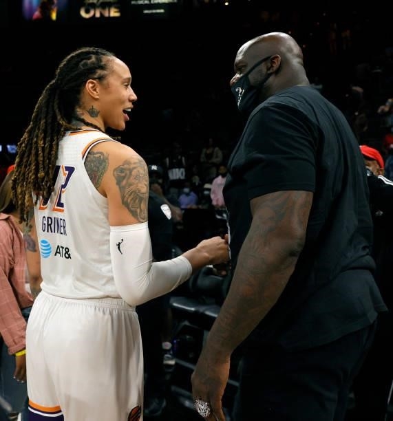 Brittney Griner of the Phoenix Mercury talks with former NBA player Shaquille O'Neal after Game Two of the 2021 WNBA Playoffs semifinals between the...