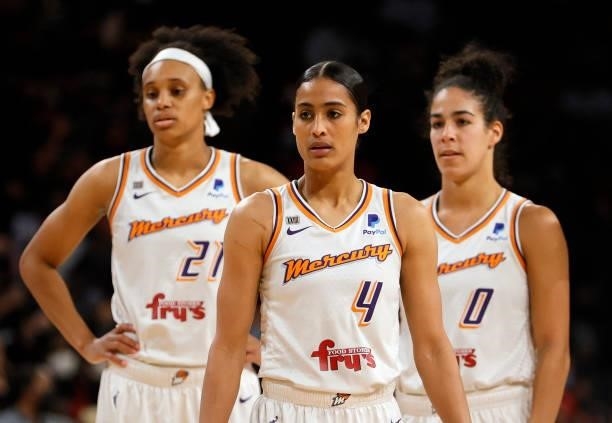 Brianna Turner, Skylar Diggins-Smith and Kia Nurse of the Phoenix Mercury stand on the court during a stop in play during Game Two of the 2021 WNBA...