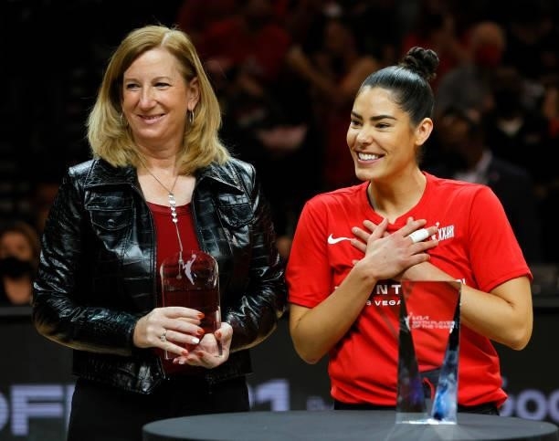Commissioner Cathy Engelbert presents Kelsey Plum of the Las Vegas Aces with the WNBA's Sixth Player of the Year award before Game Two of the 2021...