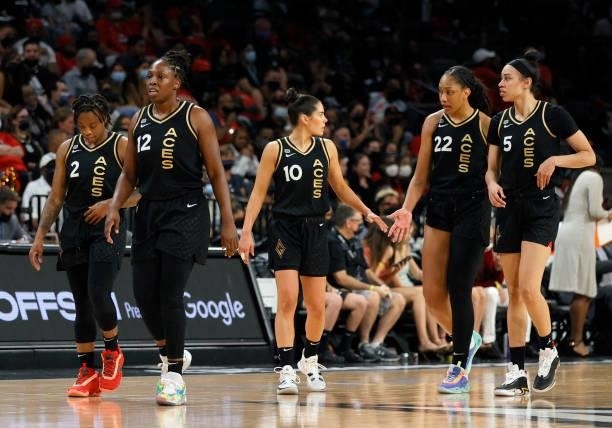 Riquna Williams, Chelsea Gray, Kelsey Plum, A'ja Wilson and Dearica Hamby of the Las Vegas Aces walk on the court after a timeout in Game Two of the...