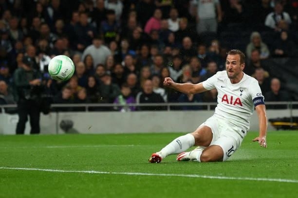 Harry Kane of Tottenham Hotspur scores their side's third goal past Matko Obradovic of NS Mura during the UEFA Europa Conference League group G match...