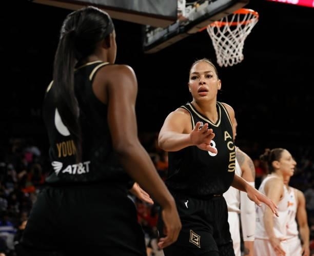 Liz Cambage of the Las Vegas Aces congratulates Jackie Young after she made a basket against the Phoenix Mercury during Game Two of the 2021 WNBA...