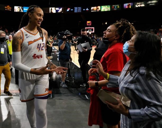 Brittney Griner of the Phoenix Mercury talks to fans as she leaves the court after Game Two of the 2021 WNBA Playoffs semifinals against the Las...