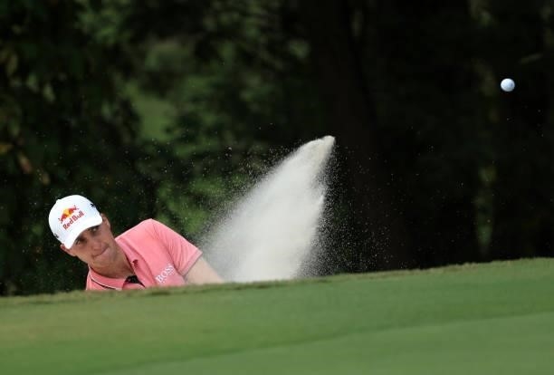 Matthias Schwab of Austria plays a shot from a bunker on the 14th hole during round two of the Sanderson Farms Championship at Country Club of...