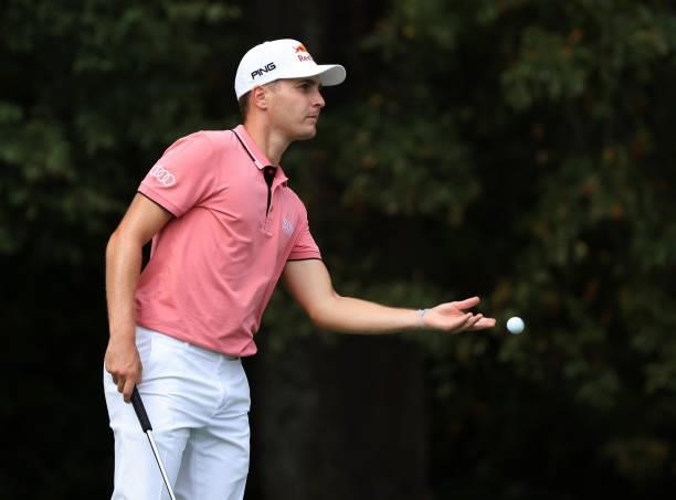 Matthias Schwab of Austria tosses his ball on the 13th green during round two of the Sanderson Farms Championship at Country Club of Jackson on...