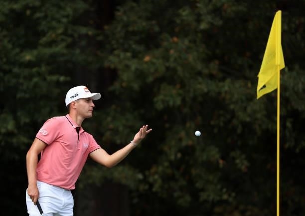 Matthias Schwab of Austria tosses his ball on the 13th green during round two of the Sanderson Farms Championship at Country Club of Jackson on...
