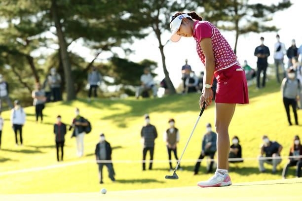 Erika Hara of Japan holes the birdie putt on the 10th green during the second round of the 54th Japan Women's Open Golf Championship at Karasuyamajo...
