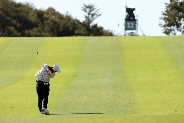 Mao Saigo of Japan hits her second shot on the 13th hole during the second round of the 54th Japan Women's Open Golf Championship at Karasuyamajo...