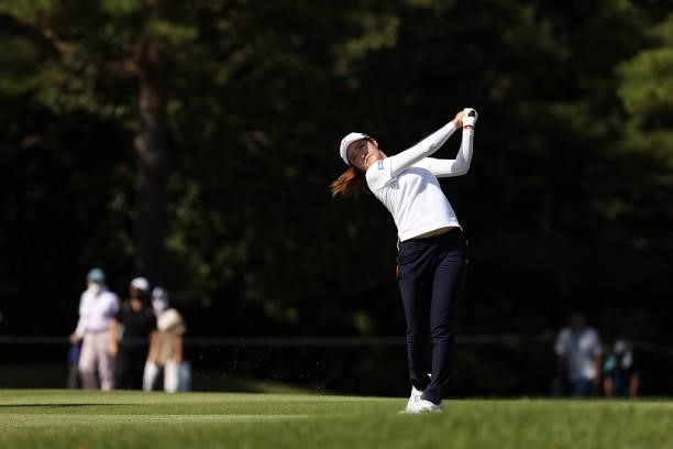 Mone Inami of Japan hits her second shot on the 2nd hole during the second round of the 54th Japan Women's Open Golf Championship at Karasuyamajo...