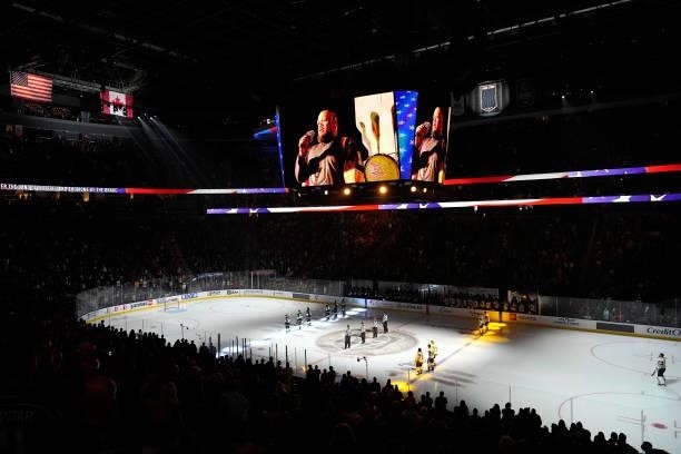 The Vegas Golden Knights and Los Angeles Kings stand on the ice for the national anthem prior to their game at T-Mobile Arena on October 01, 2021 in...