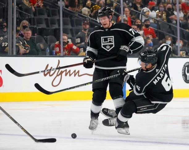 Austin Strand of the Los Angeles Kings knocks teammate Olli Maatta down as they both go after the puck in the first period of their preseason game...