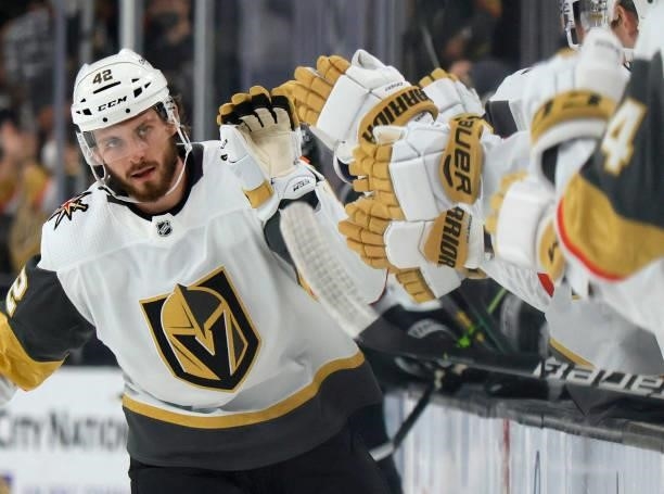 Daniil Miormanov of the Vegas Golden Knights celebrates with teammates on the bench after scoring a first-period goal against the Los Angeles Kings...