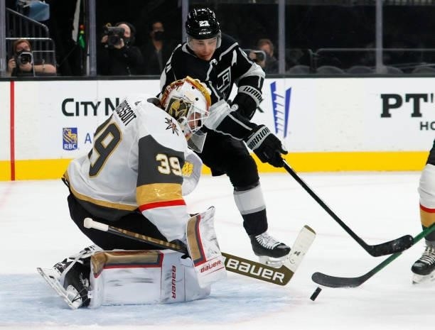 Laurent Brossoit of the Vegas Golden Knights makes a save as Dustin Brown of the Los Angeles Kings looks for a rebound in the first period of their...