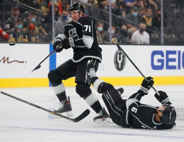 Austin Strand of the Los Angeles Kings knocks teammate Olli Maatta down as they both go after the puck in the first period of their preseason game...