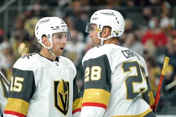 Jake Leschyshyn and William Carrier of the Vegas Golden Knights talk during a stoppage in play during the second period of a game against the Los...