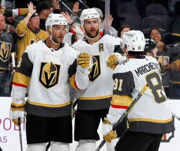 Alec Martinez, Alex Pietrangelo and Jonathan Marchessault of the Vegas Golden Knights celebrate after Martinez scored a second-period power-play goal...