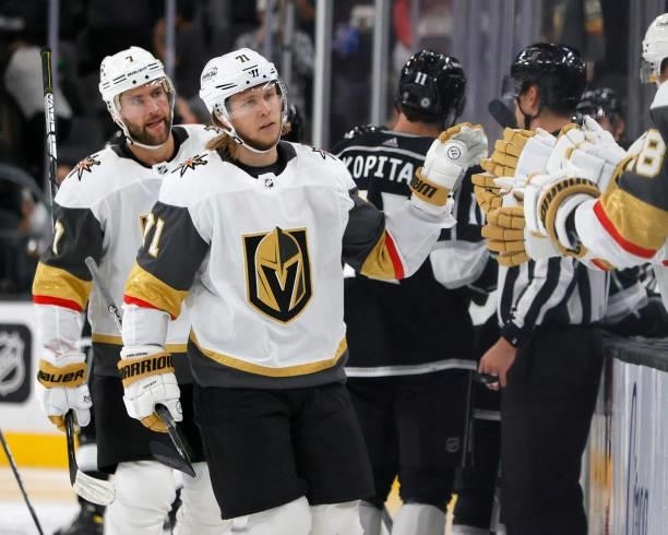 Alex Pietrangelo and William Karlsson of the Vegas Golden Knights celebrate with teammates on the bench after Pietrangelo assisted Karlsson on a...