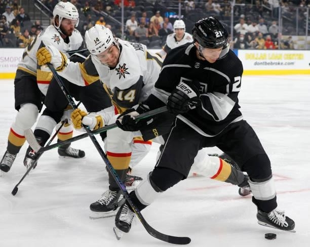 Nicolas Hague of the Vegas Golden Knights and Vladimir Tkachev of the Los Angeles Kings vie for the puck in the first period of their preseason game...