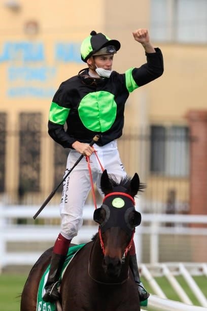 Regan Bayliss on Private Eye returns to scale after winning race 8 the TAB Epsom during Sydney Racing on Epsom Day at Royal Randwick Racecourse on...