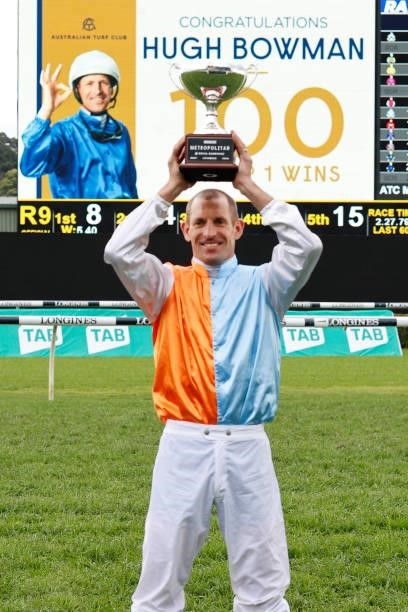 Hugh Bowman poses with the Metropolitan trophy after reaching 100 group 1 wins during Sydney Racing on Epsom Day at Royal Randwick Racecourse on...