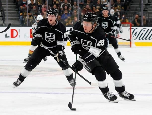 Jaret Anderson-Dolan of the Los Angeles Kings skates with the puck ahead of teammate Carl Grundstrom against the Vegas Golden Knights in the third...