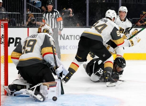 Laurent Brossoit of the Vegas Golden Knights blocks a shot by Quinton Byfield of the Los Angeles Kings as Brayden Pachal and Peter DiLiberatore of...