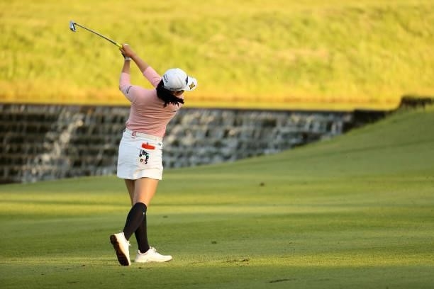 Sakura Koiwai of Japan hits her second shot on the 18th hole during the second round of the 54th Japan Women's Open Golf Championship at Karasuyamajo...