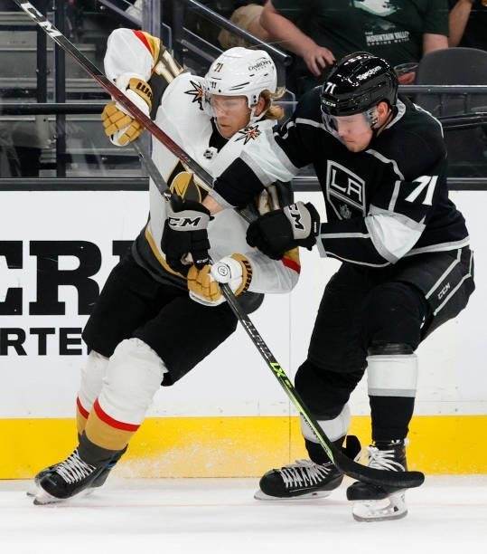 William Karlsson of the Vegas Golden Knights and Austin Strand of the Los Angeles Kings fight for the puck in the second period of their preseason...