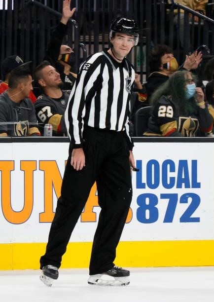 Linesman Mitchell Hunt officiates a preseason game between the Los Angeles Kings and the Vegas Golden Knights at T-Mobile Arena on October 1, 2021 in...