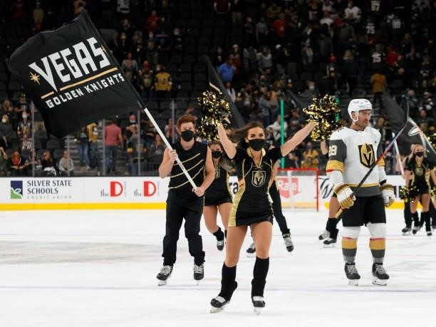 Members of the Knights Guard celebrate on the ice after the Vegas Golden Knights' 4-0 victory over the Los Angeles Kings in their preseason game at...
