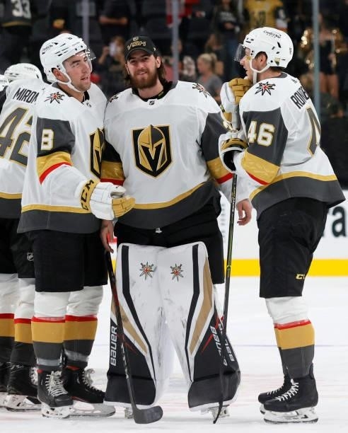 Jack Dugan, Logan Thompson and Jonas Rondbjerg of the Vegas Golden Knights celebrate the team's 4-0 victory over the Los Angeles Kings in their...