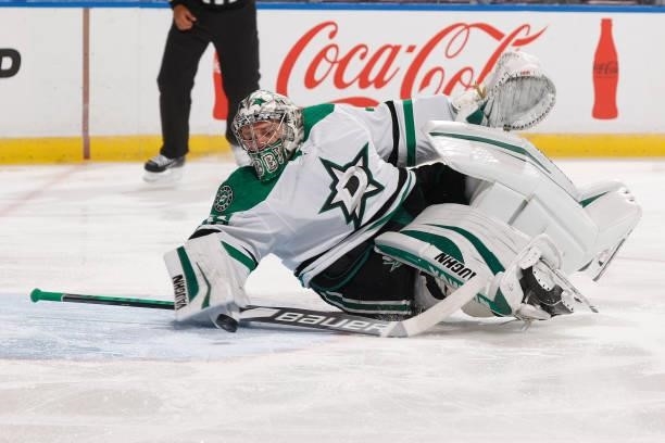 Goaltender Anton Khudobin of the Dallas Stars xlooks back as the puck shot by Aleksander Barkov of the Florida Panthers goes by to score the first...