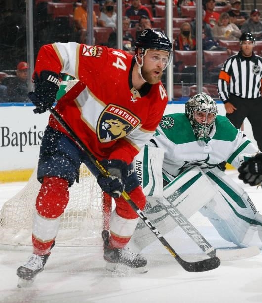 Kevin Connauton of the Florida Panthers wilts for a tipping attempt next to Goaltender Anton Khudobin of the Dallas Stars during a preseason game at...