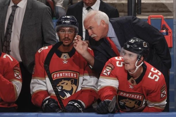 Florida Panthers Head coach Joel Quenneville talks to Servon Noel of the Florida Panthers during third period action against the Dallas Stars during...