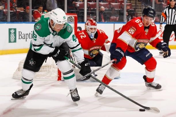 Markus Nutivaara of the Florida Panthers defends against Jordan Kawaguchi of the Dallas Stars in front of the net during a preseason game at the FLA...