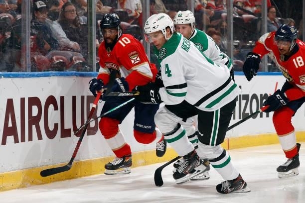 Miro Heiskanen of the Dallas Stars and Anthony Duclair of the Florida Panthers chase a loose puck during a preseason game at the FLA Live Arena on...