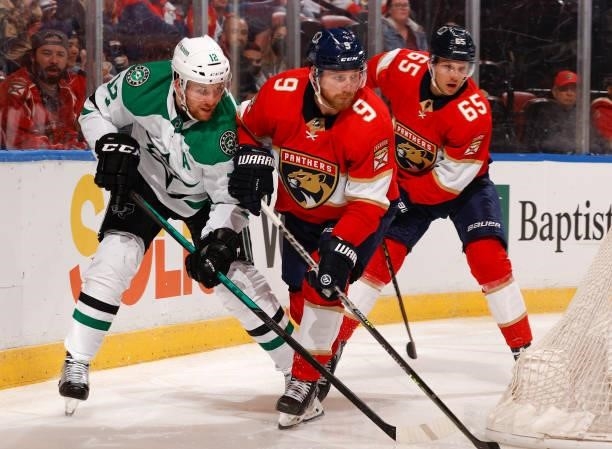 Sam Bennett of the Florida Panthers defends against Radek Faksa of the Dallas Stars during a preseason game at the FLA Live Arena on October 1, 2021...
