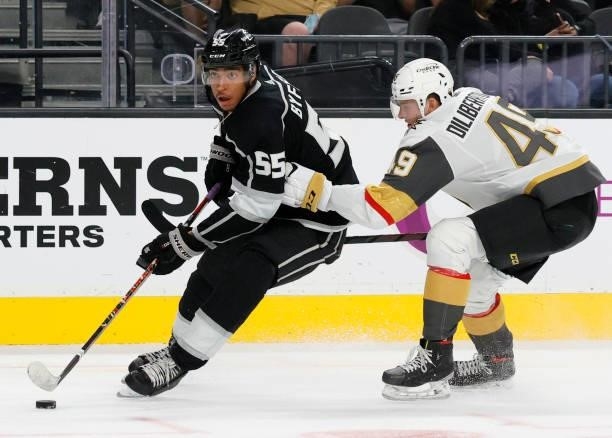 Quinton Byfield of the Los Angeles Kings skates with the puck against Peter DiLiberatore of the Vegas Golden Knights in the third period of their...