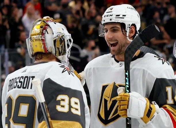 Laurent Brossoit and Nicolas Hague of the Vegas Golden Knights celebrate on the ice after the team's 4-0 victory over the Los Angeles Kings in their...