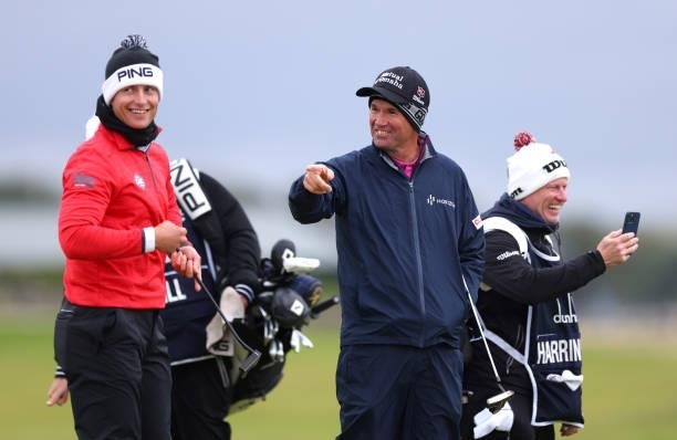 Callum Hill of Scotland, Padraig Harrington of Ireland and his caddie share a joke during Day Three of The Alfred Dunhill Links Championship at The...