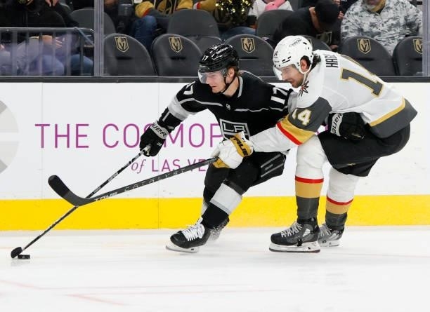 Lias Andersson of the Los Angeles Kings skates with the puck against Nicolas Hague of the Vegas Golden Knights in the third period of their preseason...