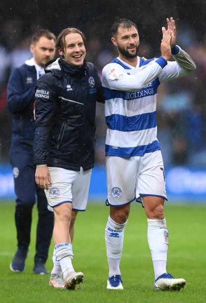 Stefan Johansen of Queens Park Rangers and Charlie Austin of Queens Park Rangers applauds fans after their sides victory in the Sky Bet Championship...