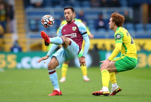 Dwight McNeil of Burnley controls the ball ahead of Josh Sargent of Norwich City during the Premier League match between Burnley and Norwich City at...