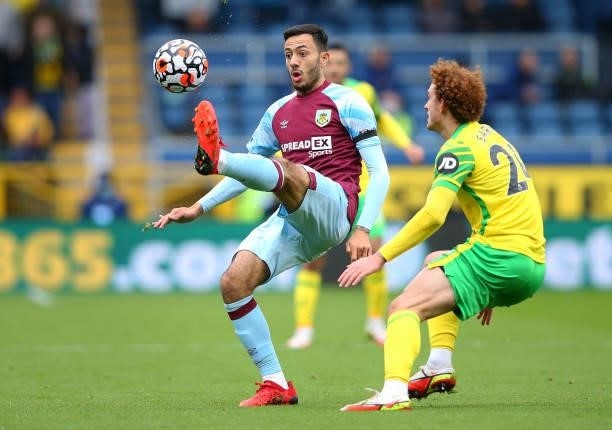 Dwight McNeil of Burnley controls the ball ahead of Josh Sargent of Norwich City during the Premier League match between Burnley and Norwich City at...